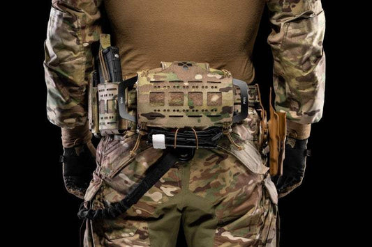 TFAK Special forces combat team wound trauma bespoke medical kit on camo uniform.